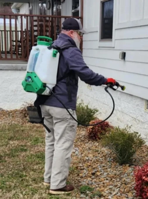 introduction image Critter Wranglers technician treating a home exterior